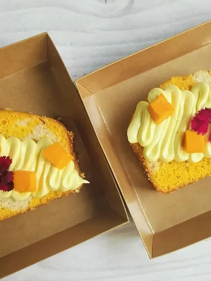 For parties and bulk orders, I offer individual cake slices. Here are two of my popular flavors: the tropical Coconut Mango and the rich Choco Pistachio marble cake slices.