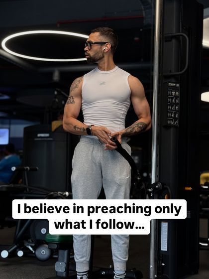 A shot of me in the gym with the caption, "I believe in preaching only what I follow." My coaching is a passion born from my own struggles.