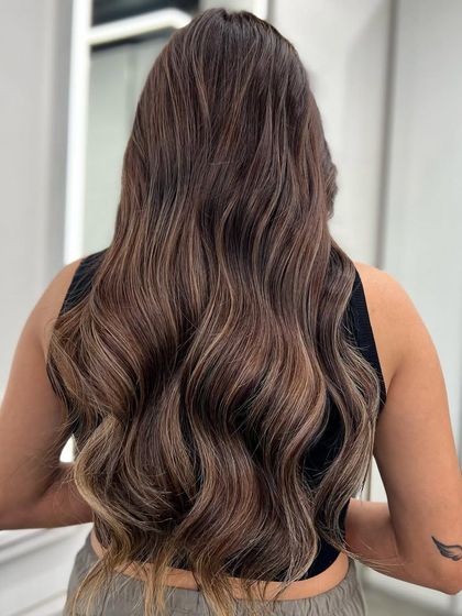 My signature balayage, designed to create a seamless, natural-looking blend of colors. This technique is perfect for adding dimension and depth to long hair.