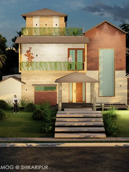 This frontal view of the Shikaripura project emphasizes the layered design, from the stone steps leading to the entrance to the green railings and rooftop terrace. Every element is designed to create a cohesive and inviting residential experience.