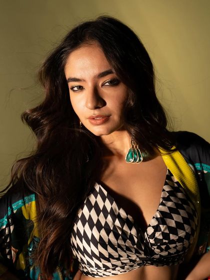 A close-up from the same set, where the wind machine adds movement to the hair, creating a dynamic and high-energy fashion shot.