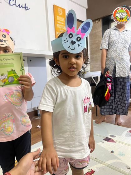 A group of our youngest campers proudly wearing their bunny headgear. It's a simple craft that brings so much happiness.