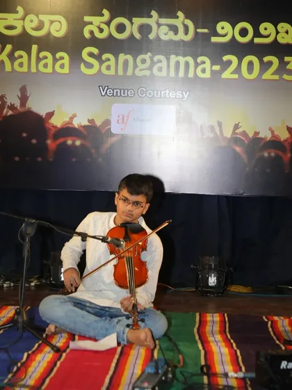 A student finds his voice through the violin, performing soulful Kannada melodies at our annual Kalaa Sangama event. We provide a stage for every student to build confidence and share their passion for music.