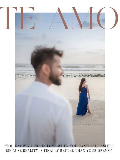 An artistic frame that feels like a magazine cover, with the groom in the foreground and the bride looking out at the sea. This kind of creative composition adds a layer of storytelling to a pre-wedding beach photo.