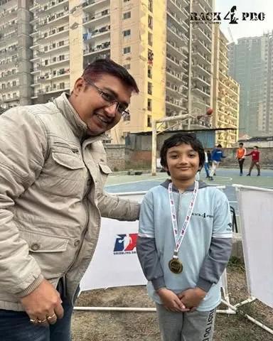 Another one of our promising young players from the U-8 category celebrating his achievement. Our program is designed to nurture talent from the very first day on the court.
