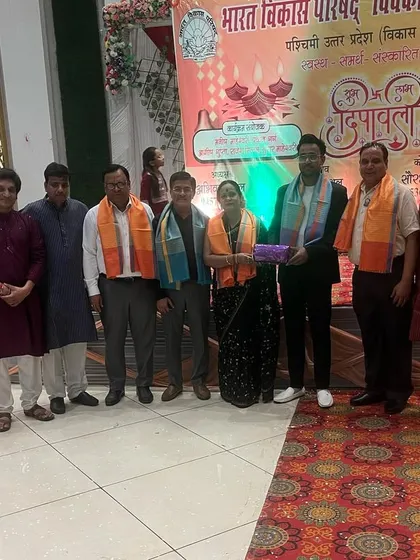 A group photo after being honored by the Bharat Vikas Parishad in Pilkhuwa during their Diwali event.
