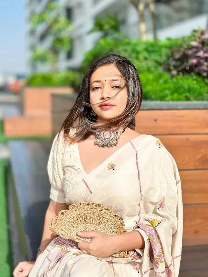 A candid portrait in the kantha saree. The wind catching my hair adds a sense of movement and life to the photo.