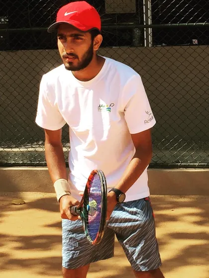 A focused look during a training session. I bring a high level of intensity and concentration to the court, setting an example for my students.