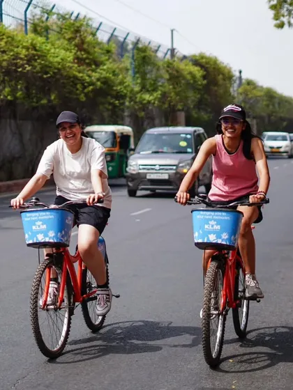 Two friends enjoying the ride side-by-side. Cycling is a great way to bond and create shared memories.