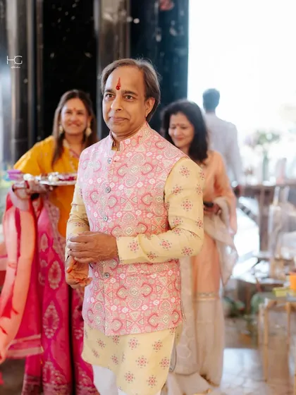 Proving that print on print can be incredibly fun and stylish. For Sanjay Kucheria, I paired a yellow printed kurta with a contrasting pink printed bundi for a bold, celebratory statement.