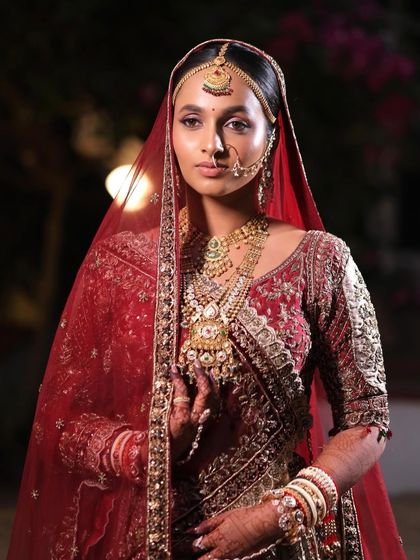 A full portrait of Laxmi's stunning Gujarati bridal look. The makeup was carefully balanced to enhance her features without overpowering her magnificent jewellery and embroidered lehenga.