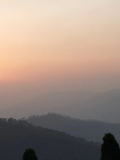 The soft light of dusk over the hills reminds us of the gentle fading of our own inner noise. This is the peaceful atmosphere that supports our letting go retreat.