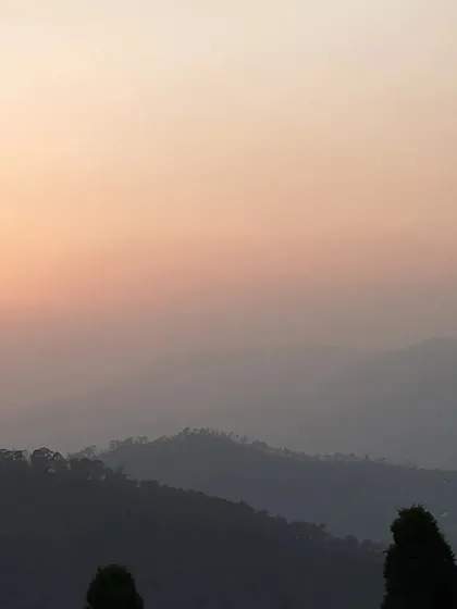 The soft light of dusk over the hills reminds us of the gentle fading of our own inner noise. This is the peaceful atmosphere that supports our letting go retreat.