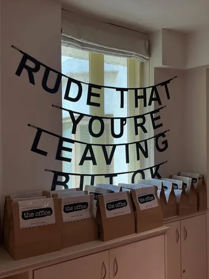 Even the party favors were on-theme. We created custom goodie bags and a banner with the classic farewell line, "Rude that you're leaving but ok," adding another layer of inside jokes for fans of the show.