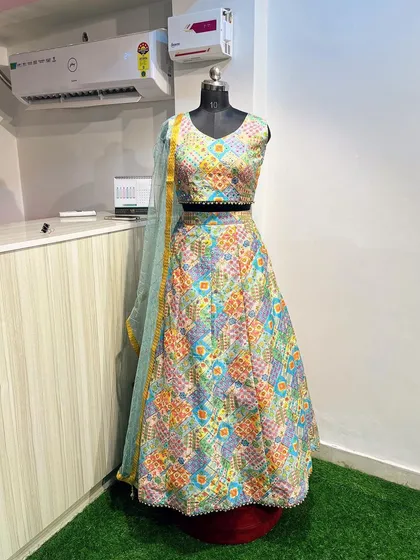 Another look at the colorful Mehendi lehenga, highlighting the beautiful blend of patterns and the delicate pearl border on the blouse.