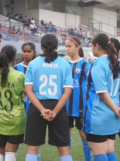 More than a team, we are a family. A pre-game huddle where our coach provides tactical instructions and motivation, reflecting our focus on strategy, mentorship, and unity.