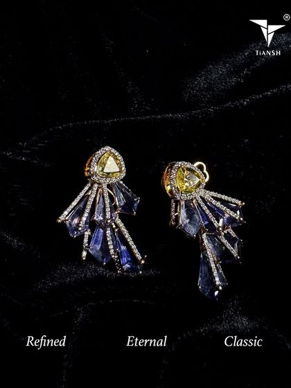 These unique earrings feature a cascade of tanzanite stones anchored by a yellow diamond. They are a perfect example of refined, eternal, and classic design.