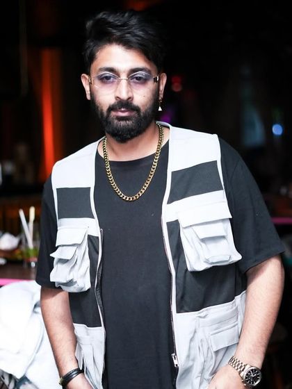 A candid shot, looking cool and collected during a Saturday night set.