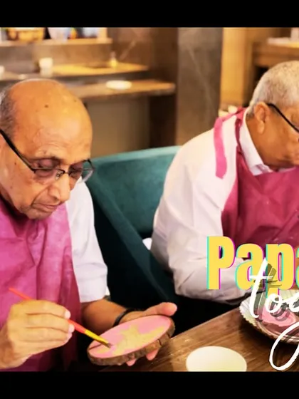 Papas painting together. It was so special to see these gentlemen, in their 70s and 80s, pick up a paintbrush for the first time and enjoy the process.