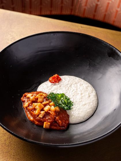 A 63-degree egg with a perfectly runny yolk is served over a bed of keema rarha, a spiced minced meat dish. This was a highlight of our festive Christmas menu.