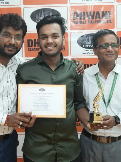 Our team of teachers presenting an award to a deserving student.