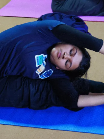 A student deep in Janu Sirsasana, the head to knee forward bend. Our courses focus on holding postures to develop flexibility and a meditative state of mind.