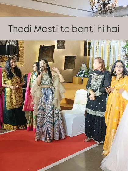 A little 'masti' is a must. Here I am, getting the family members involved in the fun during an engagement, ensuring there are smiles and laughter all around.