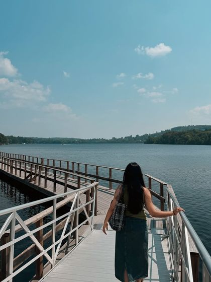 A "follow me" style shot walking along the boardwalk in Huntsville, creating an inviting and engaging travel photo.