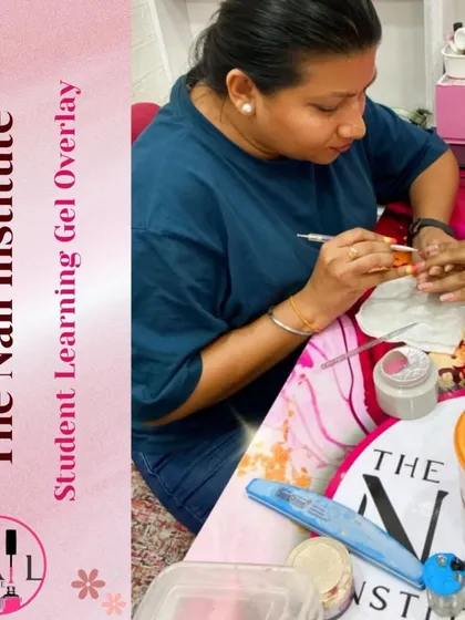 A student carefully applies a bead of gel for an overlay, a key technique for strengthening natural nails.