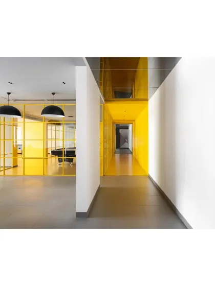 Another perspective of the hallway in 'The Amber Encase', showing the transition from the bright, active zones to calmer, more subdued areas.