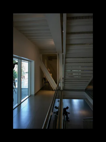 The interplay of levels and light within the MAP museum's atrium. The design uses open volumes and sightlines to create a sense of connection between different galleries and floors, encouraging exploration.