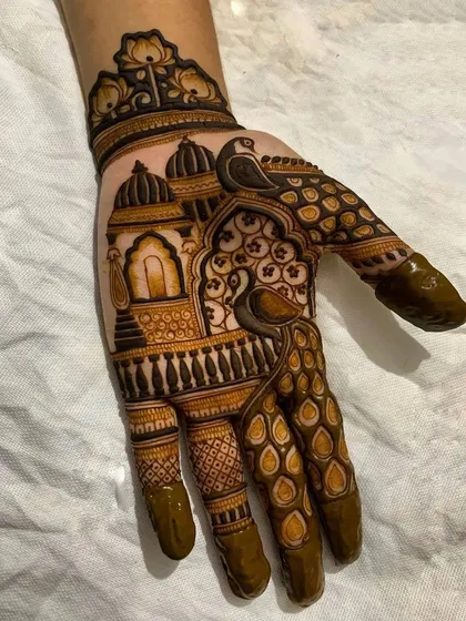 Here, I've blended two of my favorite styles. This hand design features elegant peacocks perched on a balcony, set against a backdrop of traditional Indian architectural domes.