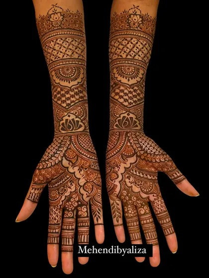 A classic full-hand bridal design with dense, intricate patterns. This style is perfect for brides who love the traditional, fully covered mehendi look.