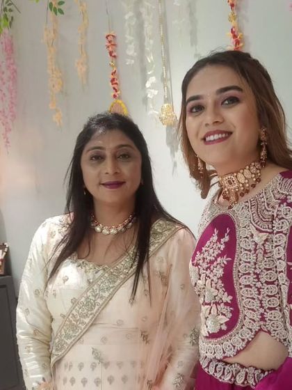 A lovely photo of two clients, both wearing elegant chokers from my collection for a festive celebration.