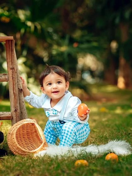 Squatting down to play with his toys, this little boy is completely in his element during this outdoor photoshoot.