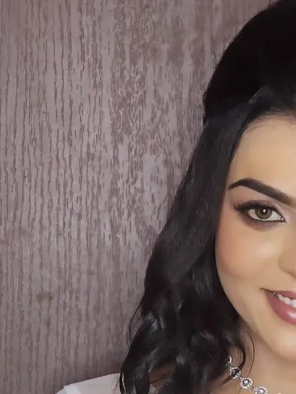 A half-face shot of a model, showcasing the beautiful eye makeup and hairstyle for a Christian wedding look.