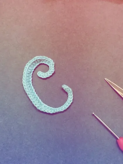 C is for 'Crochet'. This light blue letter 'C' has a beautiful swirl, perfect for personalizing any item.