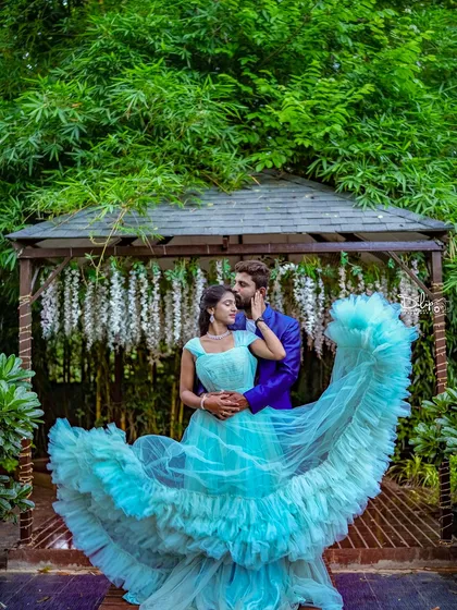 A beautiful shot of a flowing light blue gown at our garden gazebo.