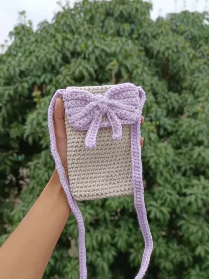 A lovely lilac and beige phone sling bag with a large bow. This is one of my most popular and feminine designs.