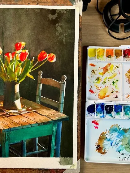The tulip still life on my desk, showing the painting in the context of my workspace with the palette nearby.