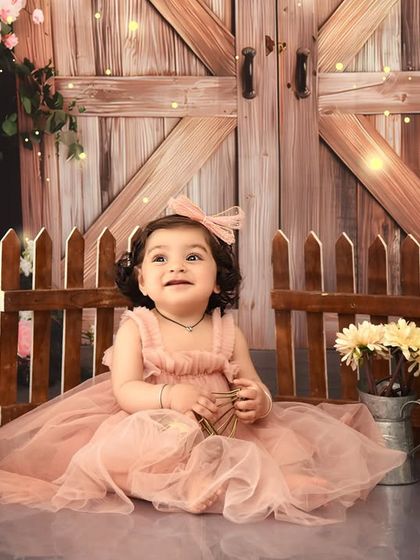 Looking up at the magical lights. This rustic first birthday theme is filled with enchanting details that create a warm and whimsical atmosphere.