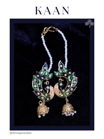 A beautiful peacock design full earcuff with Meenakari work and a delicate pearl chain.