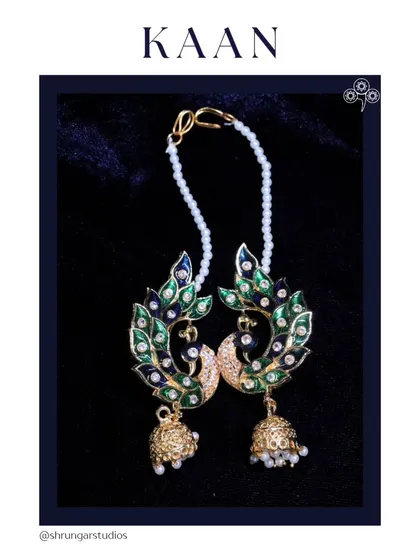 A beautiful peacock design full earcuff with Meenakari work and a delicate pearl chain.