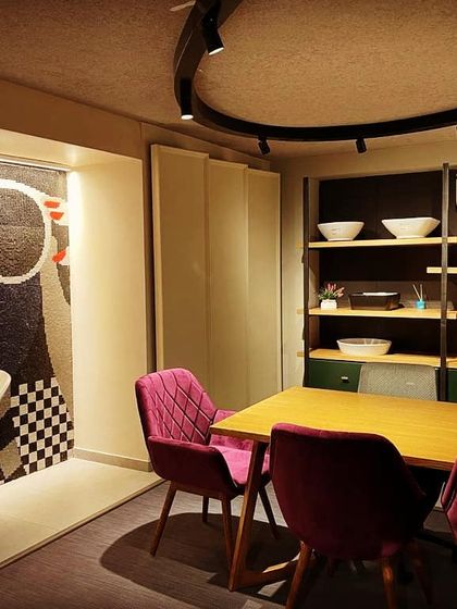 A glimpse into a high-end tile studio where lighting is key to appreciating texture and color. I used adjustable track lighting to provide flexible, high-quality illumination on the displays, ensuring clients can see the true character of the materials.