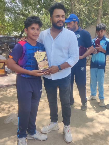 Another proud moment as I present an award to a talented young cricketer at our academy.