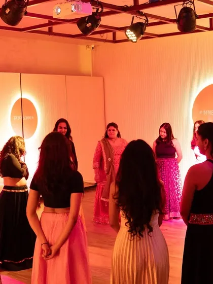 Leading a group of women in a circle of connection at The Immersion Room. These mindful movement sessions are designed to create a safe space for expression and stress relief, fostering a sense of community.