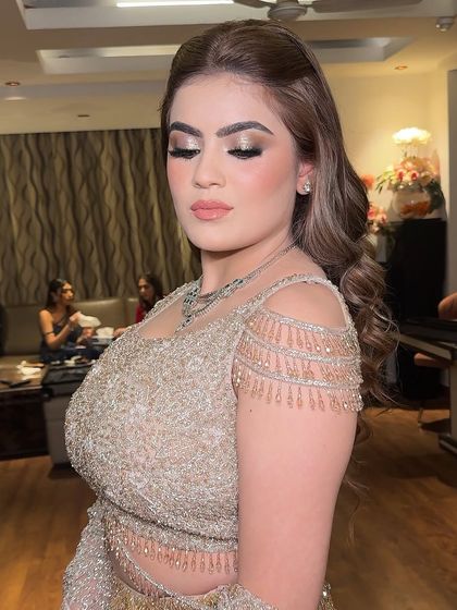 Another angle of this stunning look, showcasing the shimmering details on the eyes and the flawless skin finish.