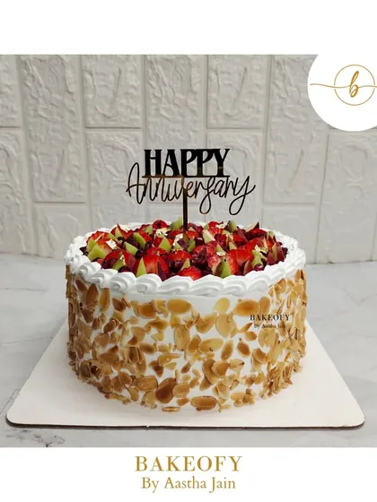 My Premium Fresh Fruit Cake is for those who love a light, fresh, and beautiful dessert. I use a soft vanilla sponge, fresh whipped cream, and top it with a vibrant mix of seasonal fruits and crunchy toasted almonds.