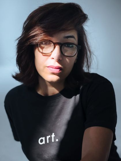 A portrait of me, Simran. The word "art" on my shirt is a simple declaration of my passion and my path as a creative entrepreneur.