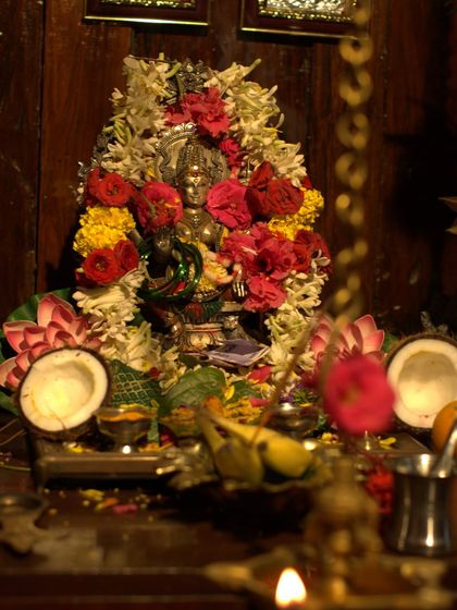 The beautifully decorated altar for Varamahalakshmi puja, with offerings of flowers, coconuts, and fruits, filling the atmosphere with devotion and positive vibrations.